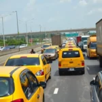 Aerial view of heavy vehicular traffic on a multi-lane nigerian highway.