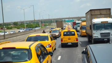 Aerial view of heavy vehicular traffic on a multi-lane nigerian highway.