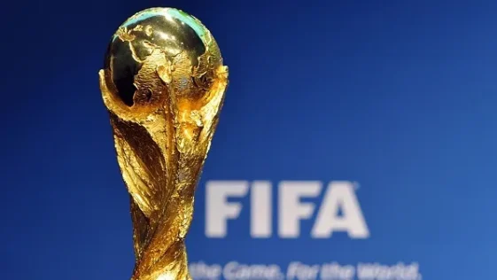 The golden fifa world cup trophy representing nigeria's 2026 qualification fate.