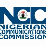 The official logo of the nigerian communications commission on a building.