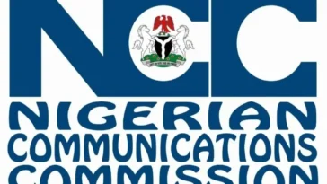The official logo of the Nigerian Communications Commission on a building.