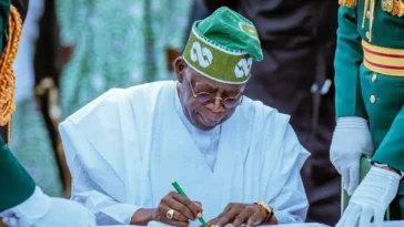 Close-up portrait of president bola tinubu in traditional attire.